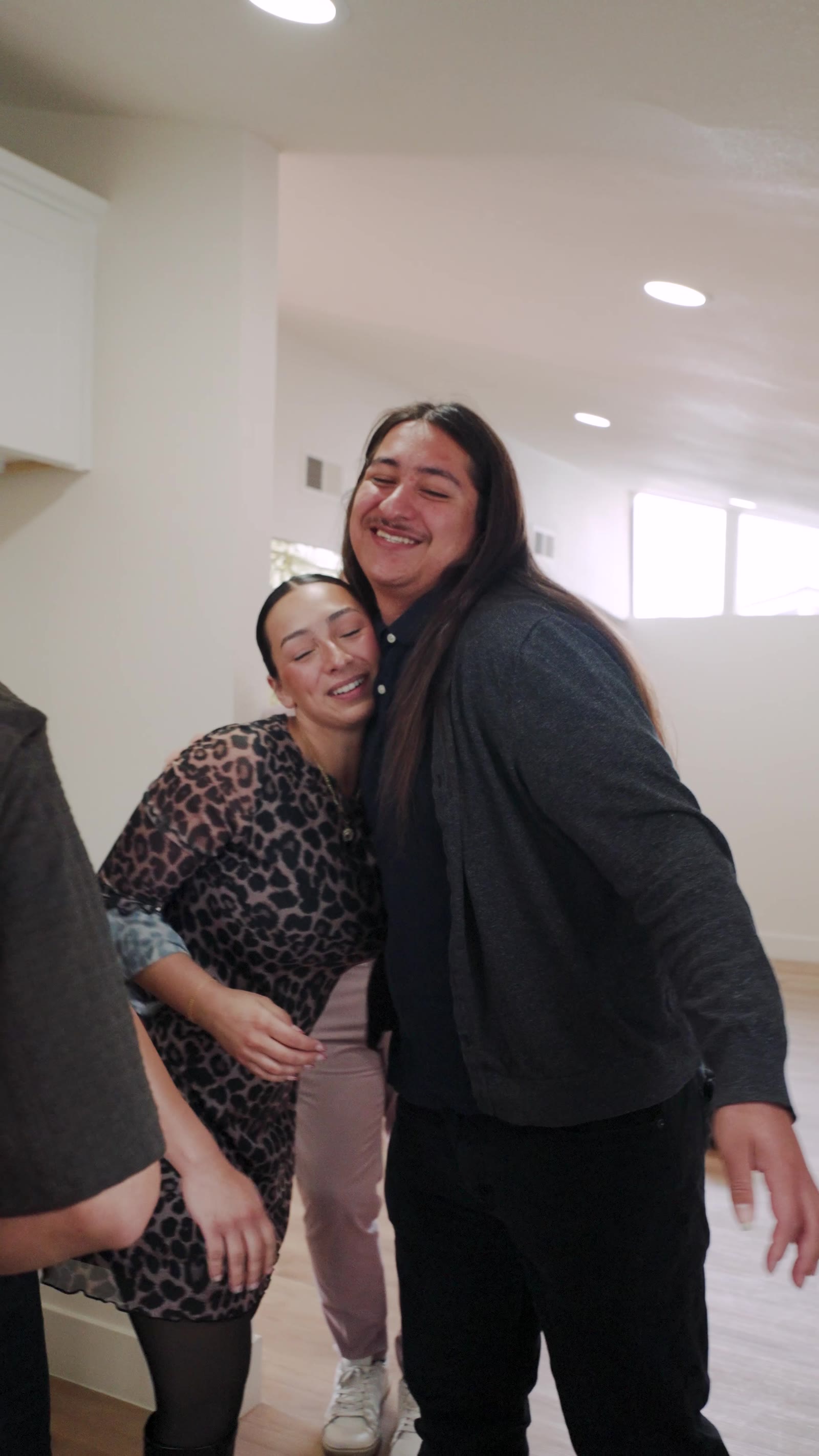 Haylee celebrating with a client in their new home