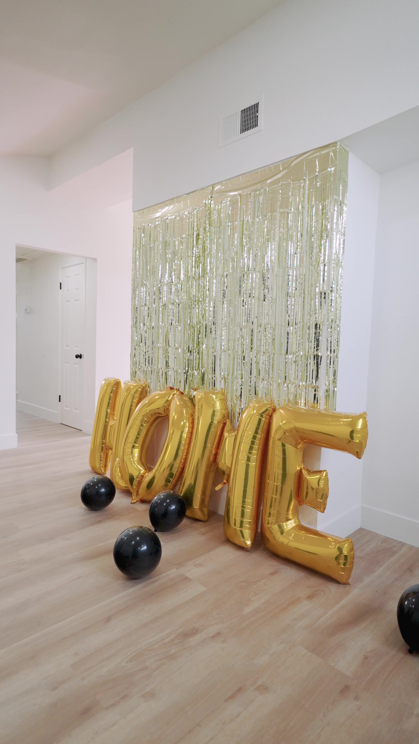 HOME balloon decor for a closing day celebration
